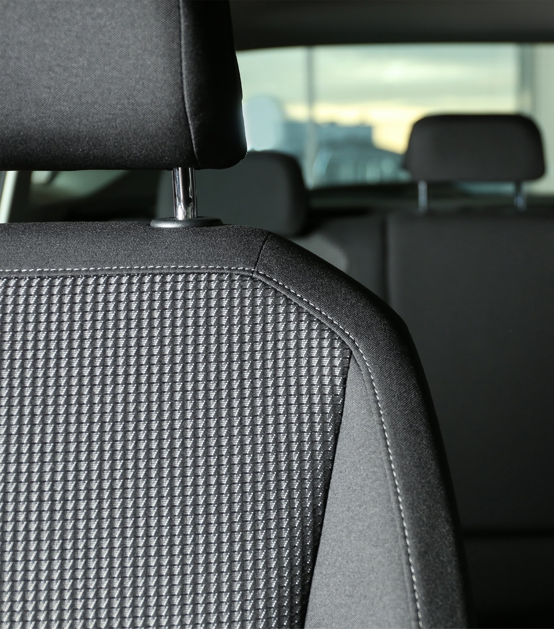 Car seat with grey upholstery, closeup view